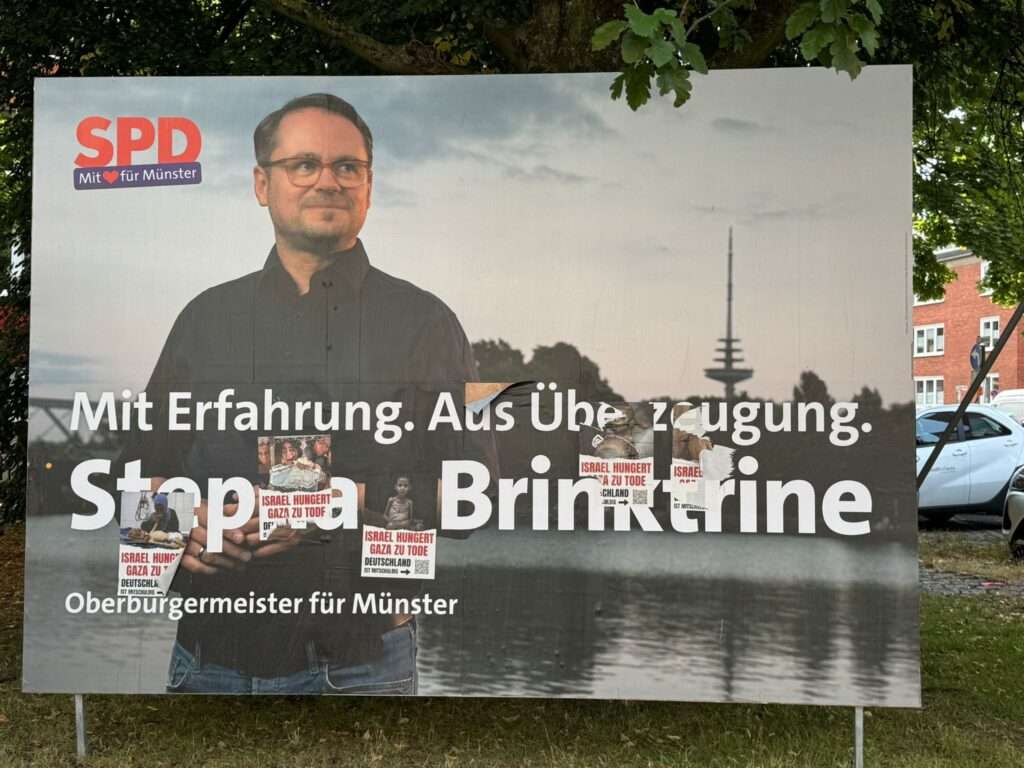 Wahlplakate in Münster erneut beschädigt: Die IDL kritisiert die „Free Gaza“-Graffiti als Angriff auf die Demokratie.