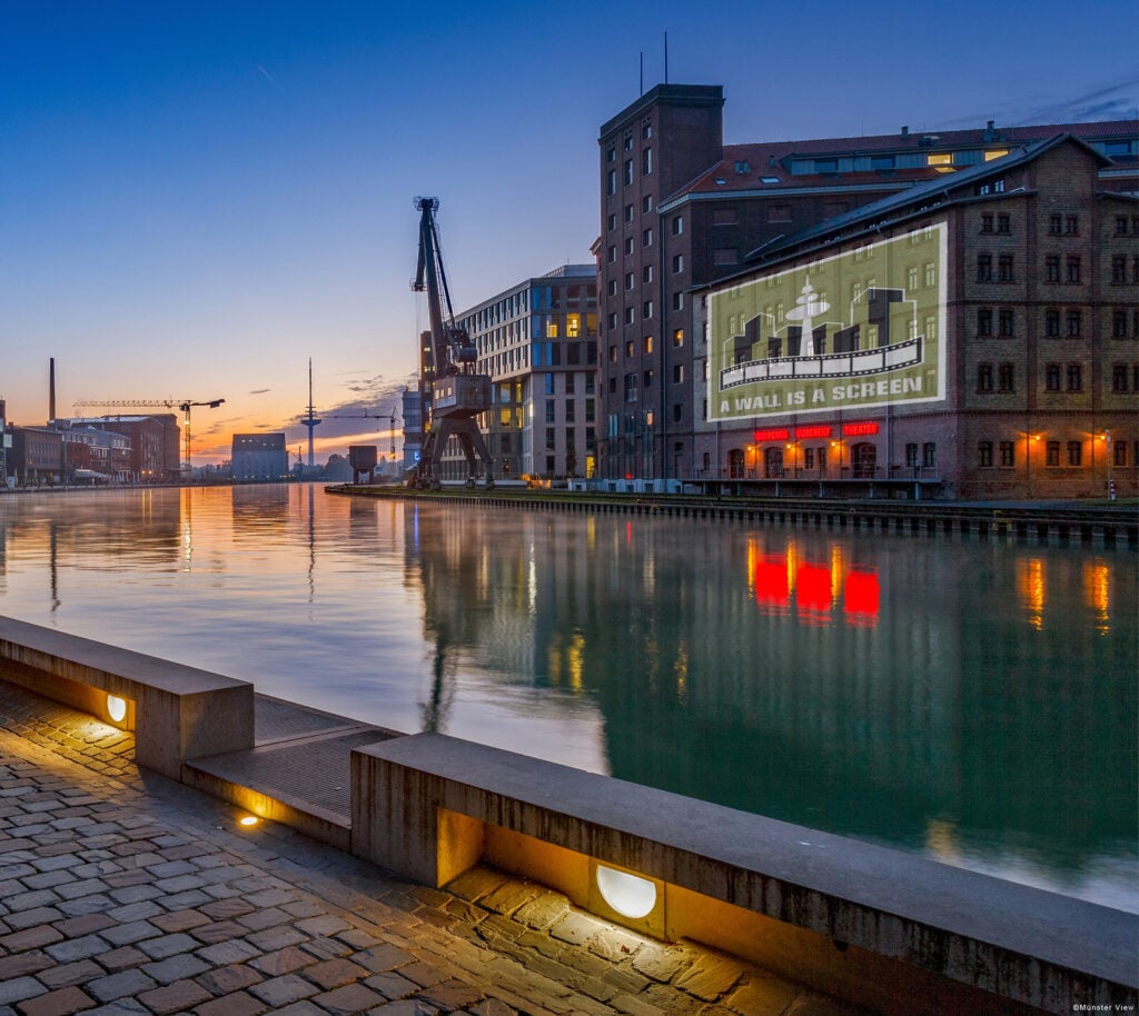 Münsters Hafen wird am 31. Oktober zum Open-Air-Kino. Alle Infos zur kostenlosen Kurzfilmwanderung mit „A Wall is a Screen“.